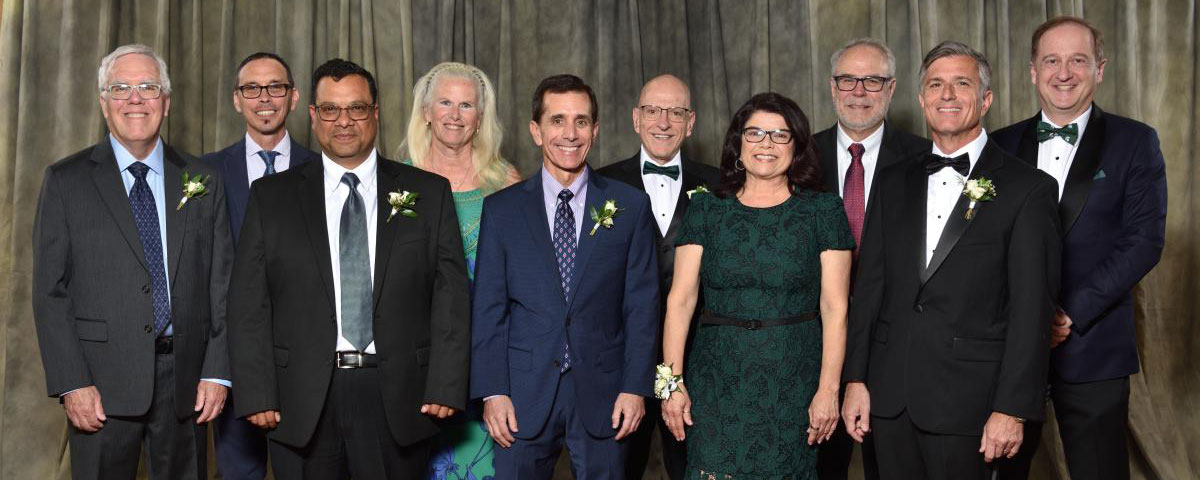 Group photo of 2026 Alumni Award winners dressed in formal wear for the celebration