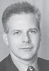 black and white professional headshot of Daniel Brouse