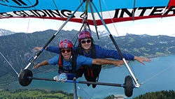two people hang gliding in Switzerland while on a weekend break from the study abroad program in Aachen Germany