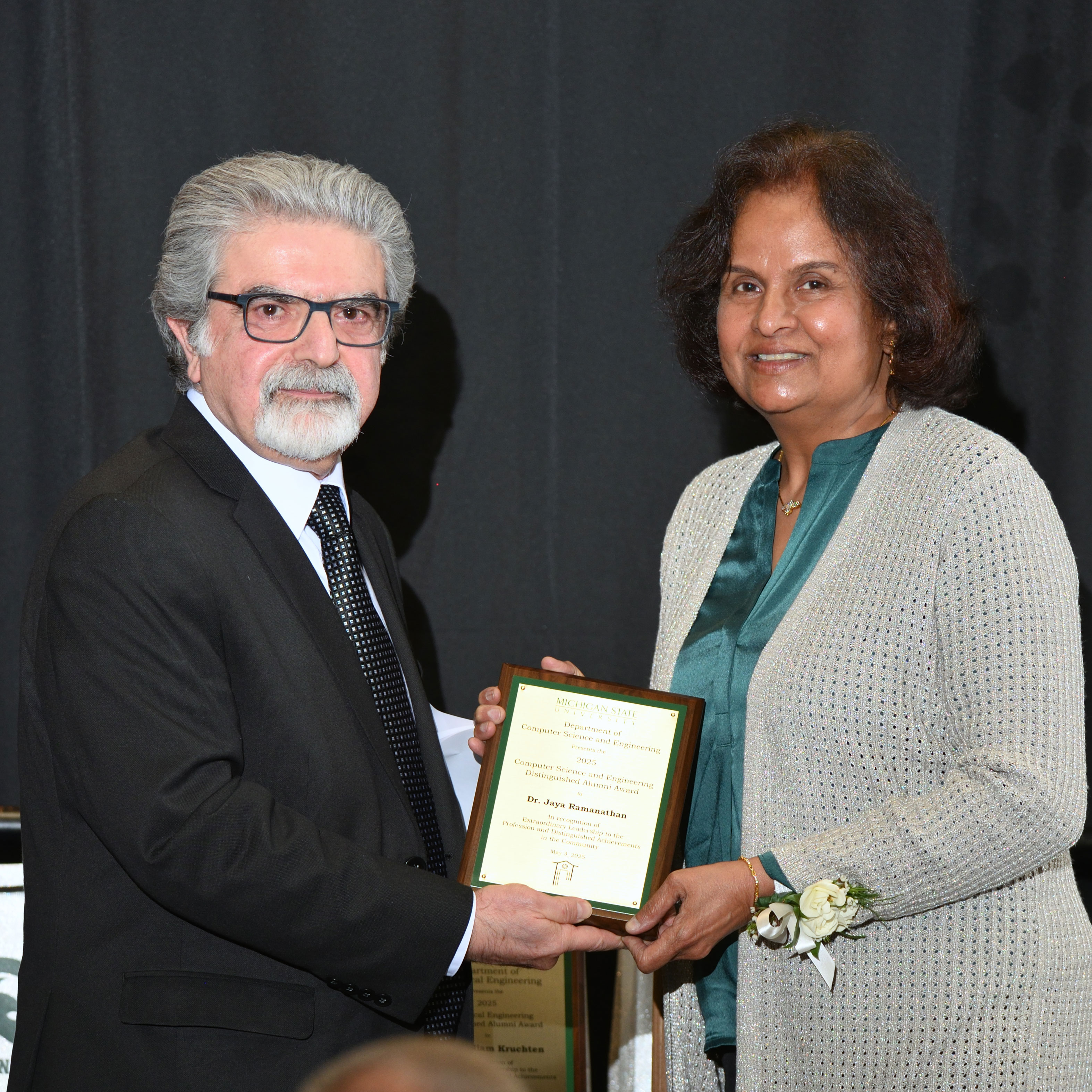 Abdol Esfahanian and Jaya Ramanathan posing with the award