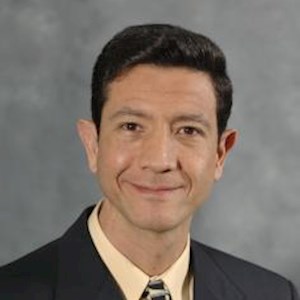 Professional headshot of Luis Donado