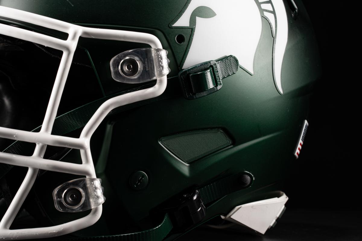 The earhole of a Spartan football helmet