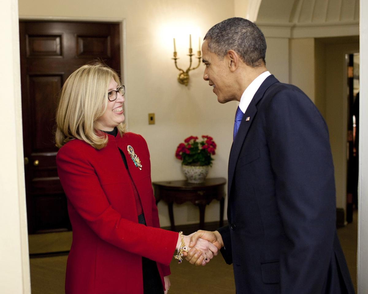 Then-President Barack Obama presents Teresa K. Woodruff with the Presidential Award for Excellence in Science, Mathematics and Engineering Mentoring in an Oval Office ceremony in 2011. Photo credit: Photo credit: Pete Souza