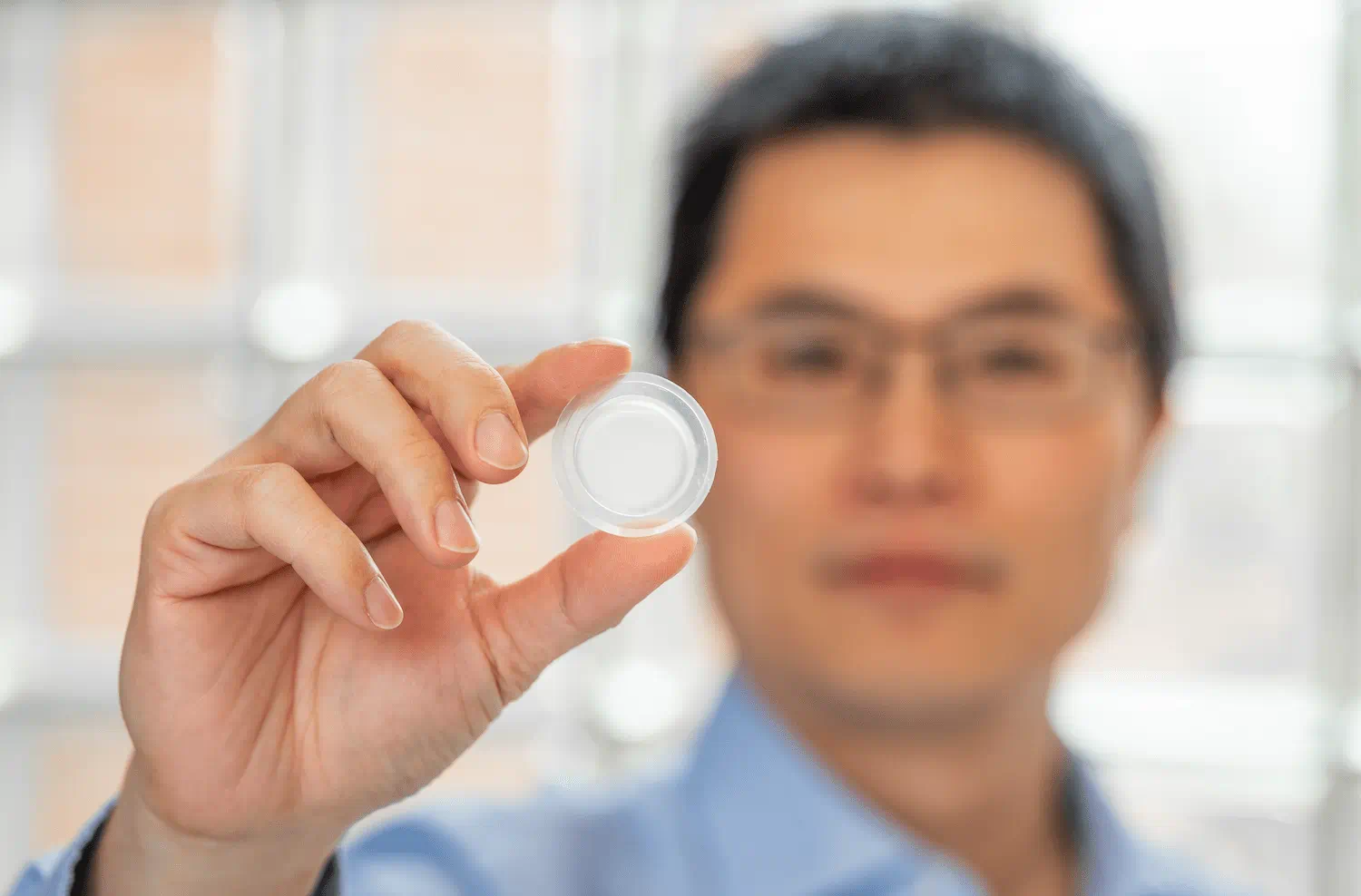 Individual holding liquid nanofoam inside of a plastic pouch