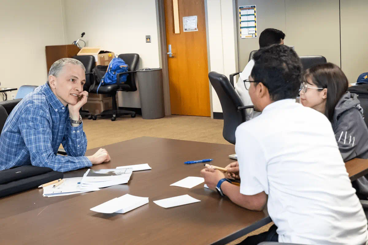 S. Patrick Walton, associate dean for academic programs, talks with participants at the computation tools workshop