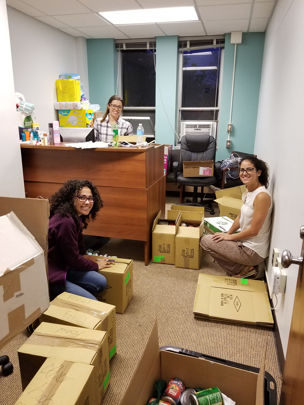 Uncommon will -- Graduate students Sylmarie Davila-Montero (front left) and Angelica Medina-Cucurella (back) joined with other volunteers, including Celizbets Colón-Ortiz (right) to collect needed items for hurricane-torn Puerto Rico.
