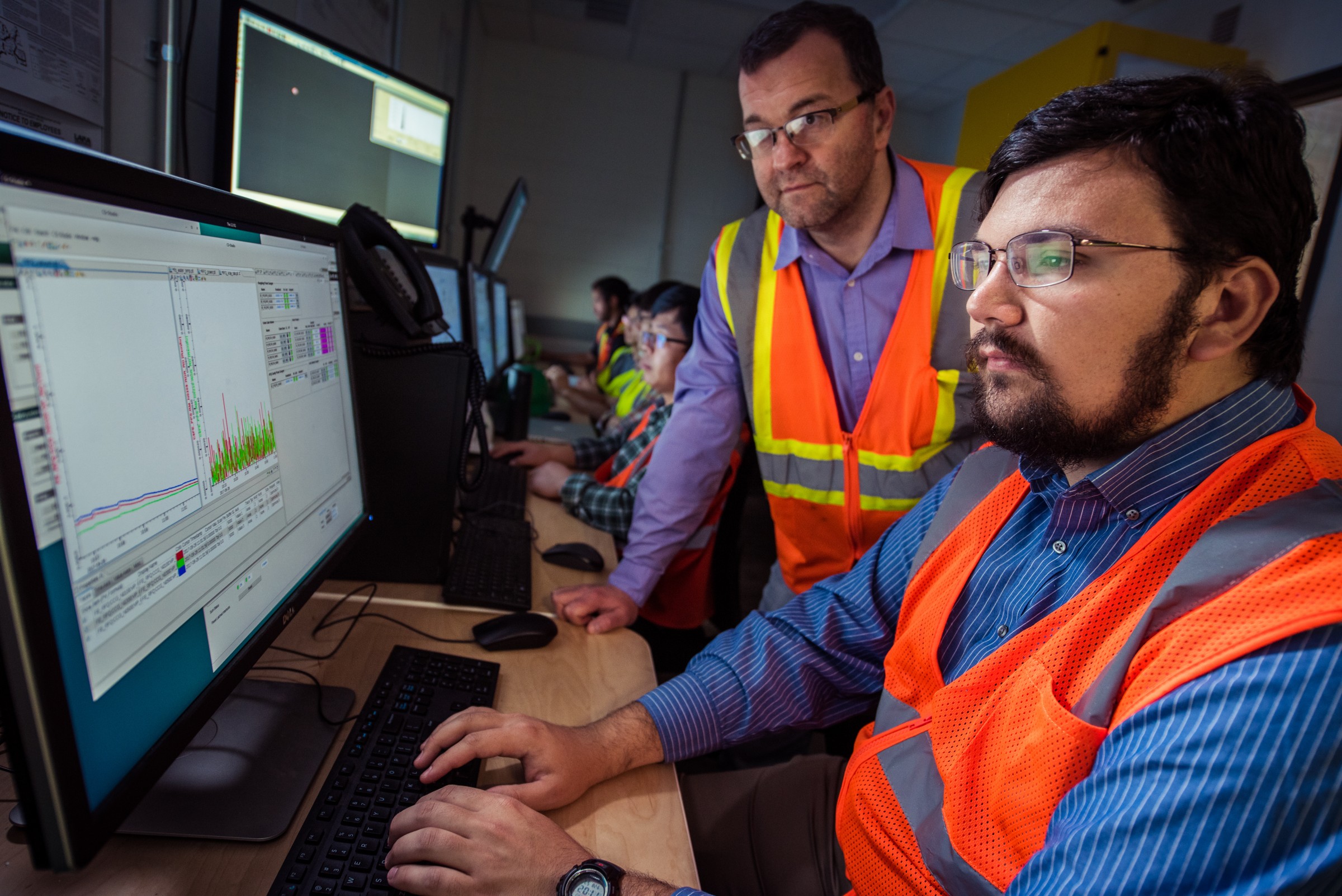 FRIB Front End Department Manager Eduard Pozdeyev reviews data with Graduate Student Michael Balcewicz in FRIB's control room.