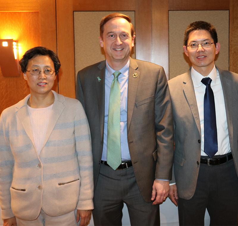 John Papapolymerou, chair of electrical and computer engineering, (center) congratulated TongTong Li (left) and Xiaobo Tan for their recognitions during the annual awards luncheon.