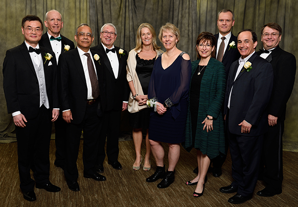 The 2018 Alumni Award winners are (l to r) JC Mao, Brad Borgman, Prabhat Shukla, James Susan, Lisa Sparrow, Tracy Camp, Mitzi Montoya, Darius Adamczyk (back), and Green Apple Teaching Award winner Steven Kosmas, all hosted by Engineering Dean Leo Kempel.