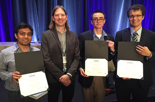 MSU won the "foxhunt" at the 2018 IEEE Antennas and Propagation Symposium Student Design Competition by designing and building a radio system that located a radio transmitter and sounded a radio channel. Pictured are (l to r) Pratik Chatterjee, Professor Jeffrey Nanzer, Anton Schlegel and Billy Stevers. Missing from photo is Justin Opperman.