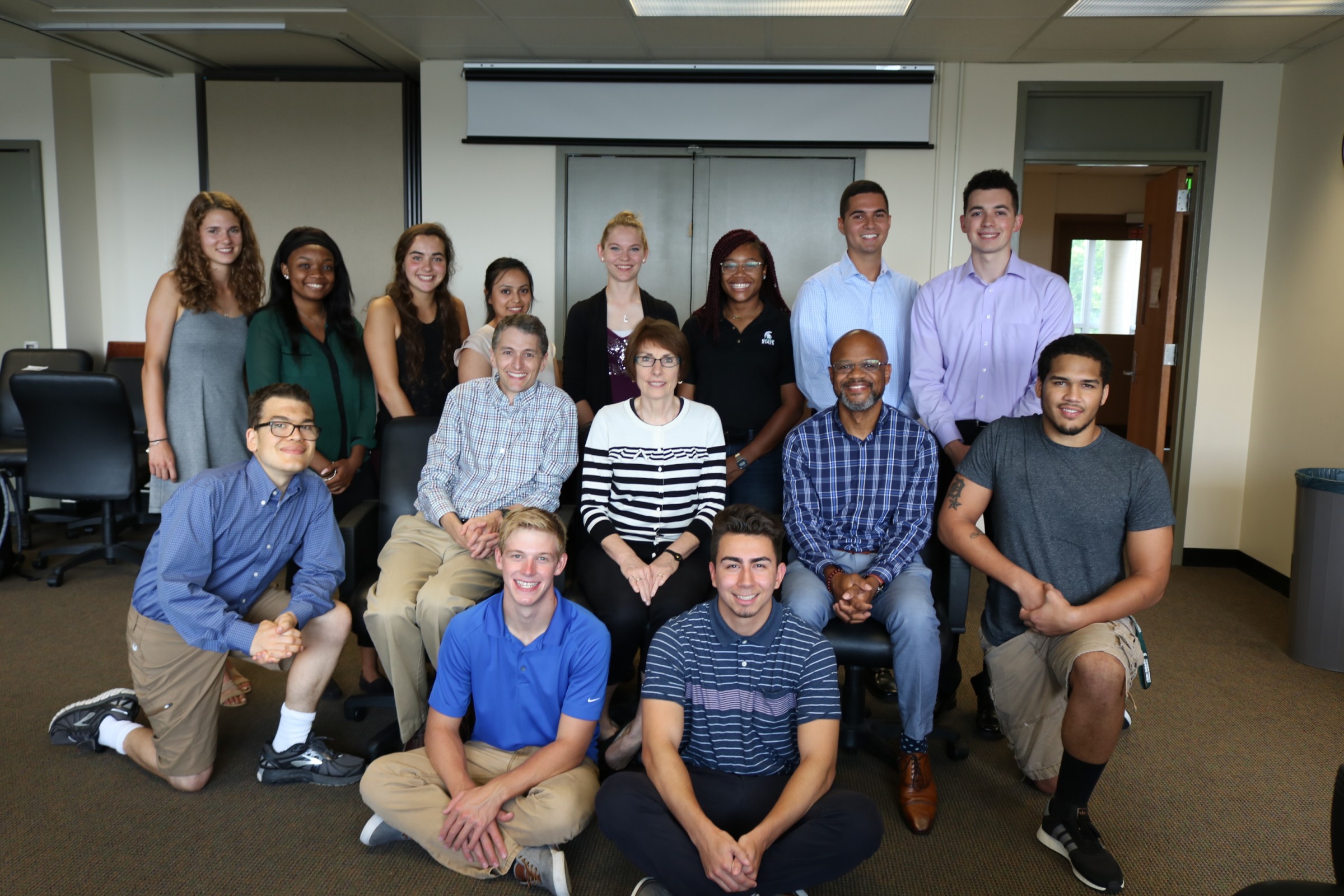 MSU's SEE Scholars work with (seated in center) SEE Directors S. Patrick Walton, Daina Briedis, and Theodore Caldwell, who team up to give the scholars academic, professional and social supports.
