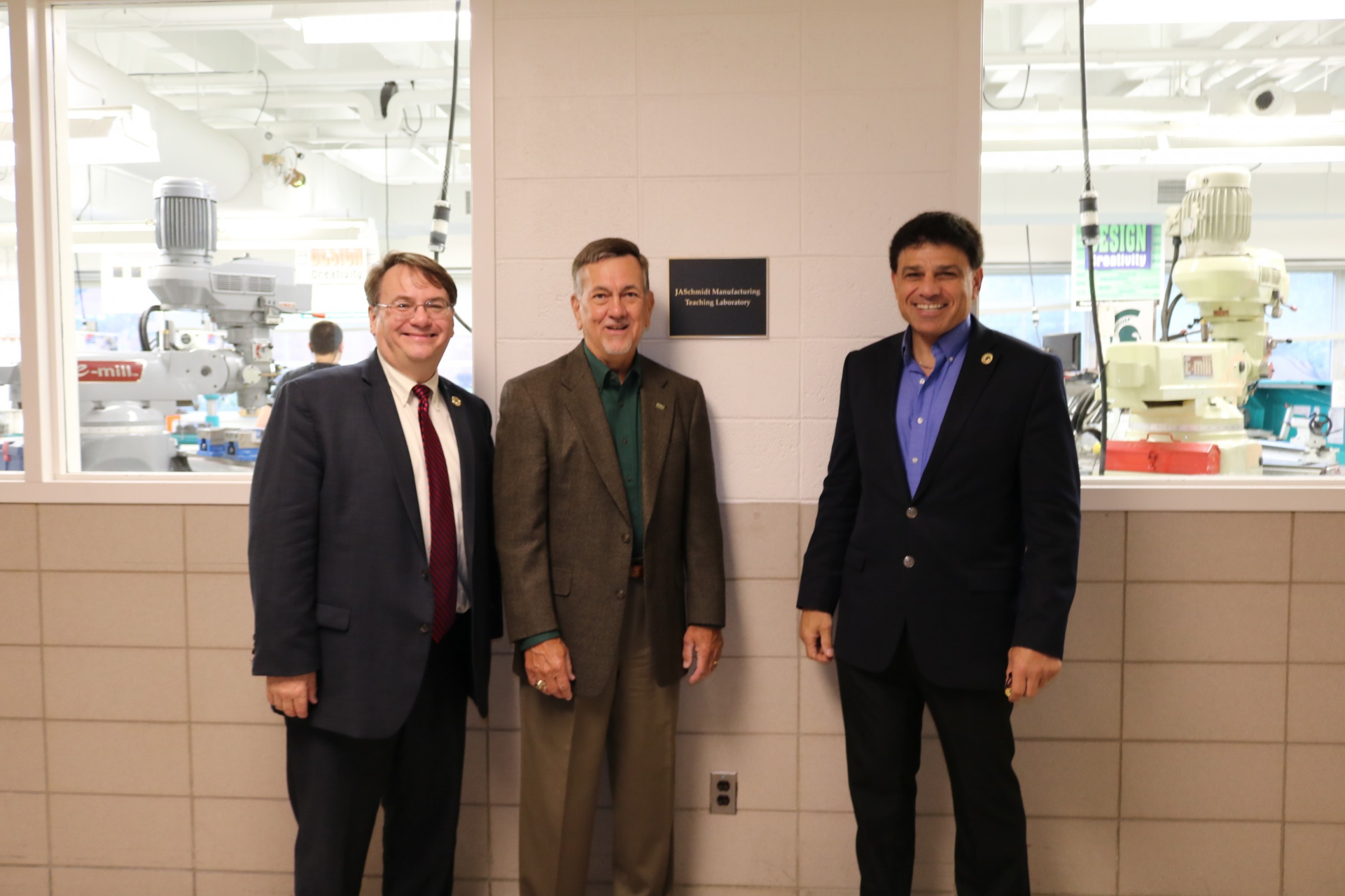 Dean Leo Kempel joined James A. Schmidt '71 and Mechanical Engineering Chair James Klausner for the lab dedication on Sept. 10.