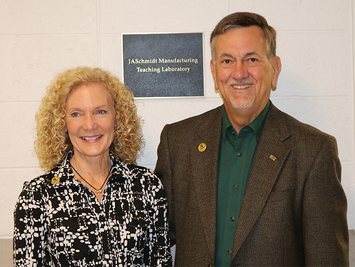 Karen West joined James A. Schmidt '71 at the dedication of the JASchmidt Manufacturing Teaching Laboratory in the Engineering Building.