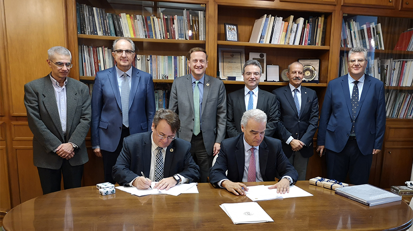 MSU and NTUA have formalized a dual PhD program to train professionals. Officiating (seated, left to right) at the ceremony were MSU Engineering Dean Leo Kempel and NTUA Rector John Golias, and (standing) Elias Glytsis, Outgoing Associate Chair for Graduate Studies, ECE Dept. NTUA; Marinos Kavouras, Incoming NTUA Vice-Rector for Academic Affairs and Administration; MSU ECE Department Chair and Professor John Papapolymerou; Nektarios Koziris, Dean of the School of ECE, NTUA; Dimitris Papantonis, Outgoing NTUA Vice-Rector for Academic Affairs and Administration; and Dimitris Soudris, Incoming Associate Chair for Graduate Studies, ECE Dept., NTUA.