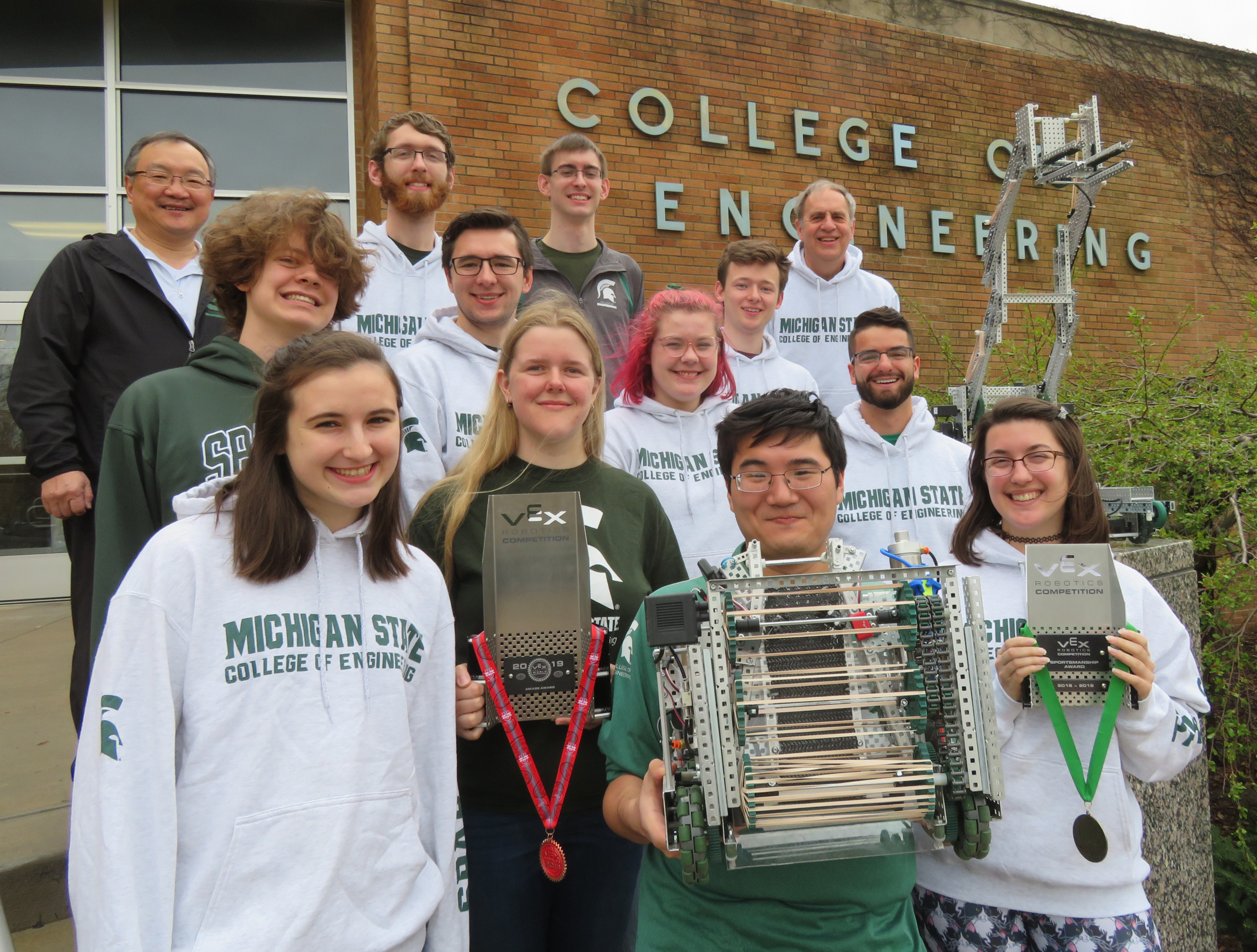 MSU's VEX U Robotics Team is (front, left) Caitlin Colsia, Diana Dalski, Declan Liu, Kati Pilant, (second row) Skijlar Howerzyl, David Waltz, Lauren McIntyre, Jake Aprilliano, (third row) Drew Kim, Paul Schulte, Matt Watson, Jacob Swaneck, Bob Watson, and missing from photo are Kent Bazman, Anneke Howerzyl, Katie Frayer, and Joe Gazall.