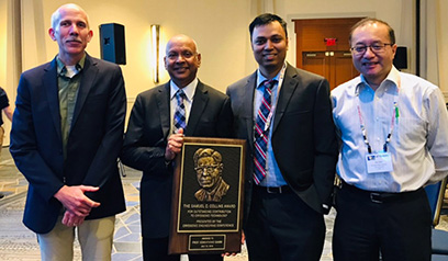MSU Cryogenics Initiative Director Venkatarao Ganni (second from left) received the 2019 Samuel C. Collins Award. From left are Senior Cryogenic Process Engineer Peter Knudsen, Ganni, Cryogenic Process Engineer Nusair Hasan, and FRIB Accelerator Systems Division Director Jie Wei.
