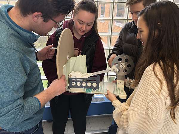 More than 550 students will showcase their projects on Design Day on Dec. 6. Projects will include a stamping mechanism created by Jacob Bruner, Audrey Schroeder, Matthew Rightor, and Megan Weiss.