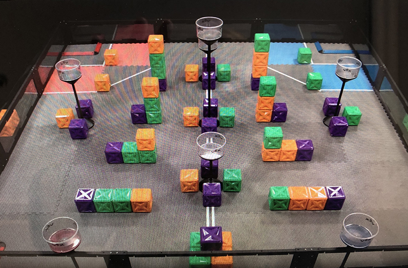 This year's game, VEX Turning Point, uses 66 colorful cubes on a Tower Takeover Field.