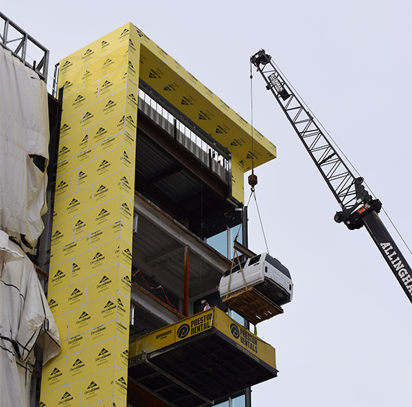 The therapy car was hoisted into the McLaren's construction project before the new hospital's walls were completed.