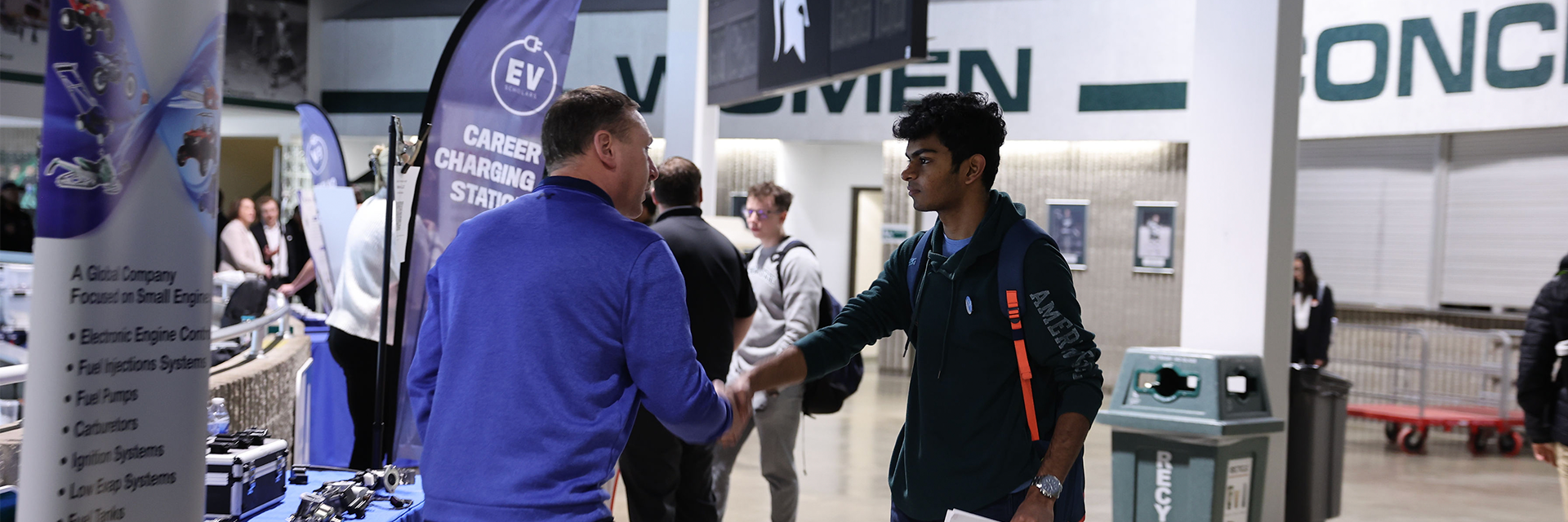 Student shaking hands with recruiter