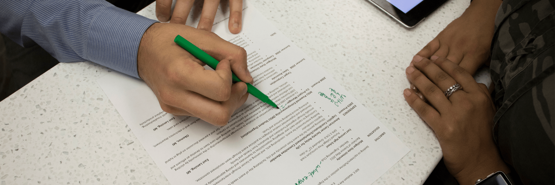 Person writing with pen on paper