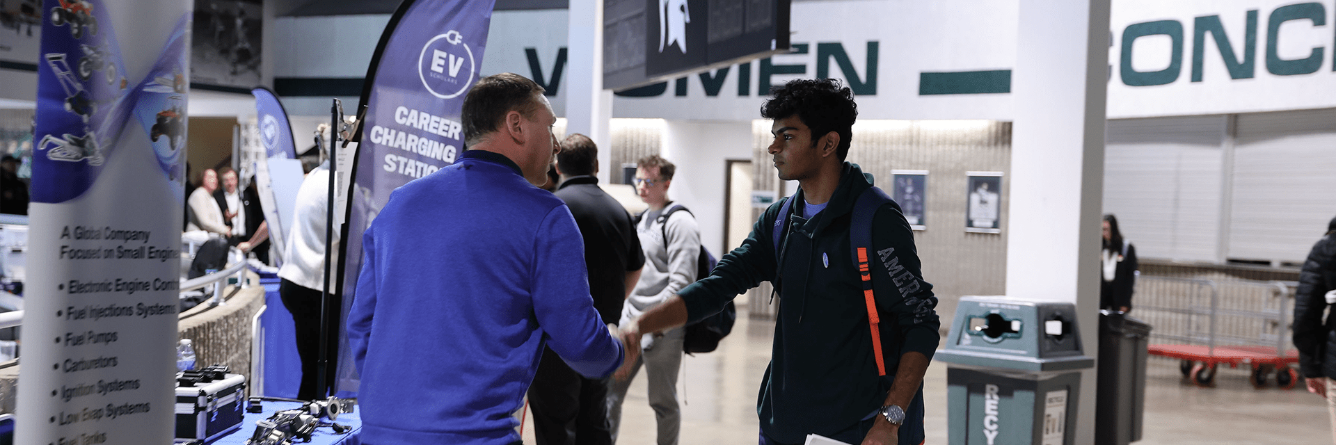 Student shaking hands with recruiter