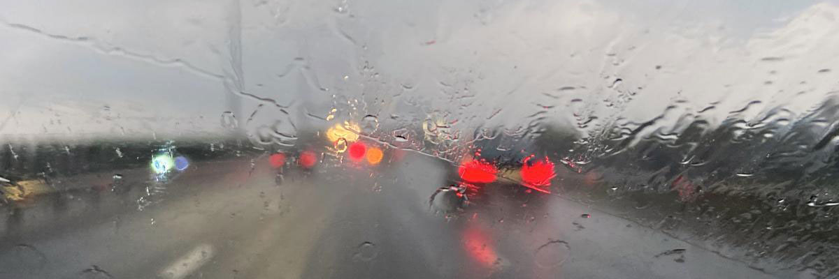 View through a car windshield on a rainy day