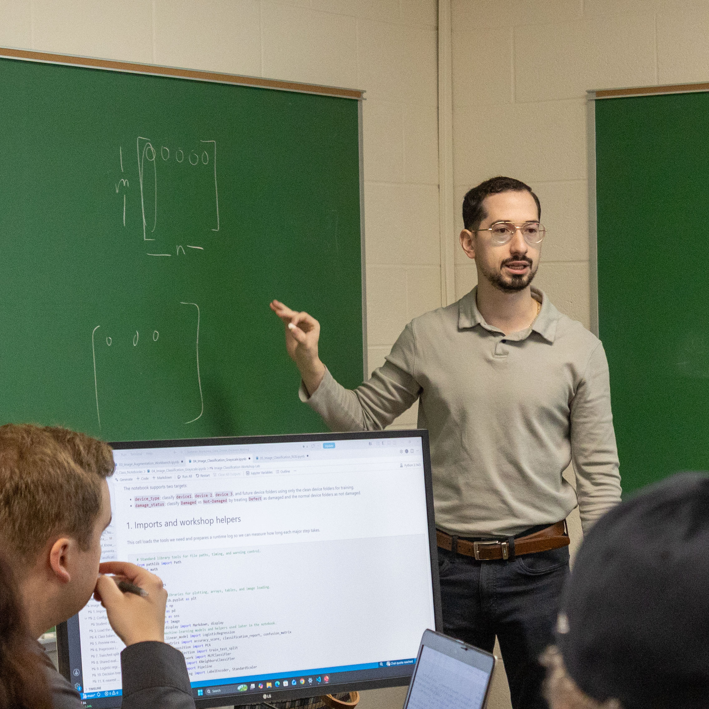 Professor instructing students