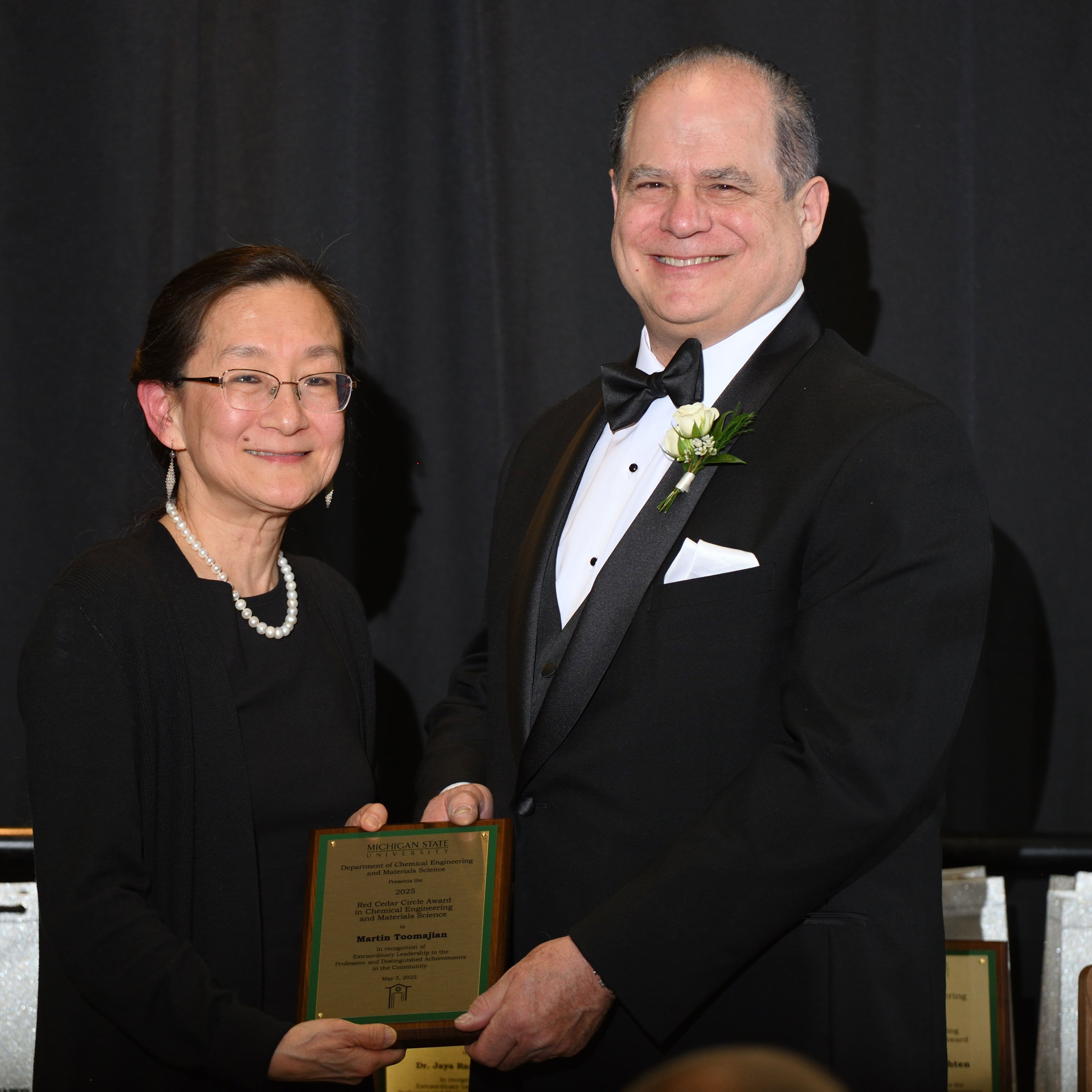 Christina Chan and Martin Toomajian posing with the award