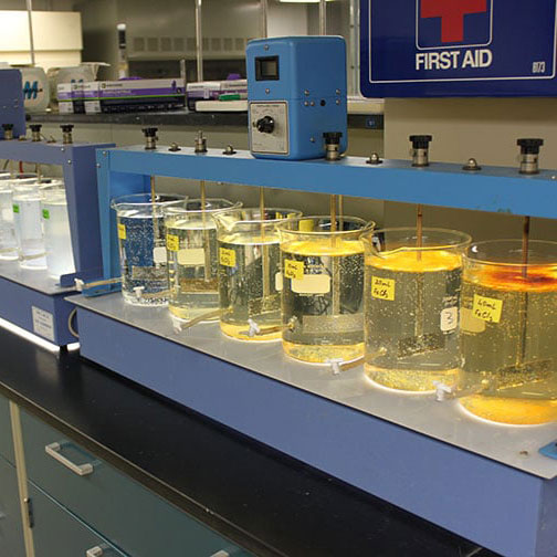 Row of beakers attached to a system