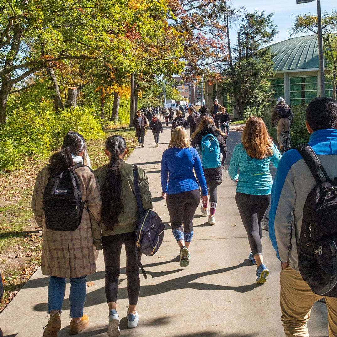 Students walking across a bridge
