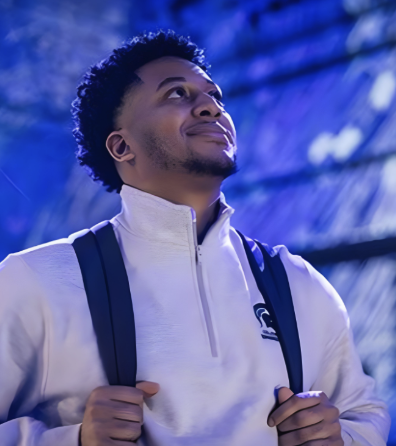 Person looking upward with a hopeful expression