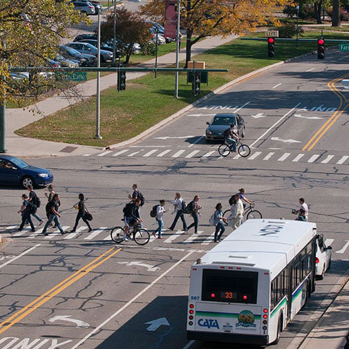 Students walking across the crosswalk