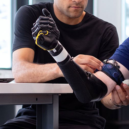 Student working on a mechanical arm