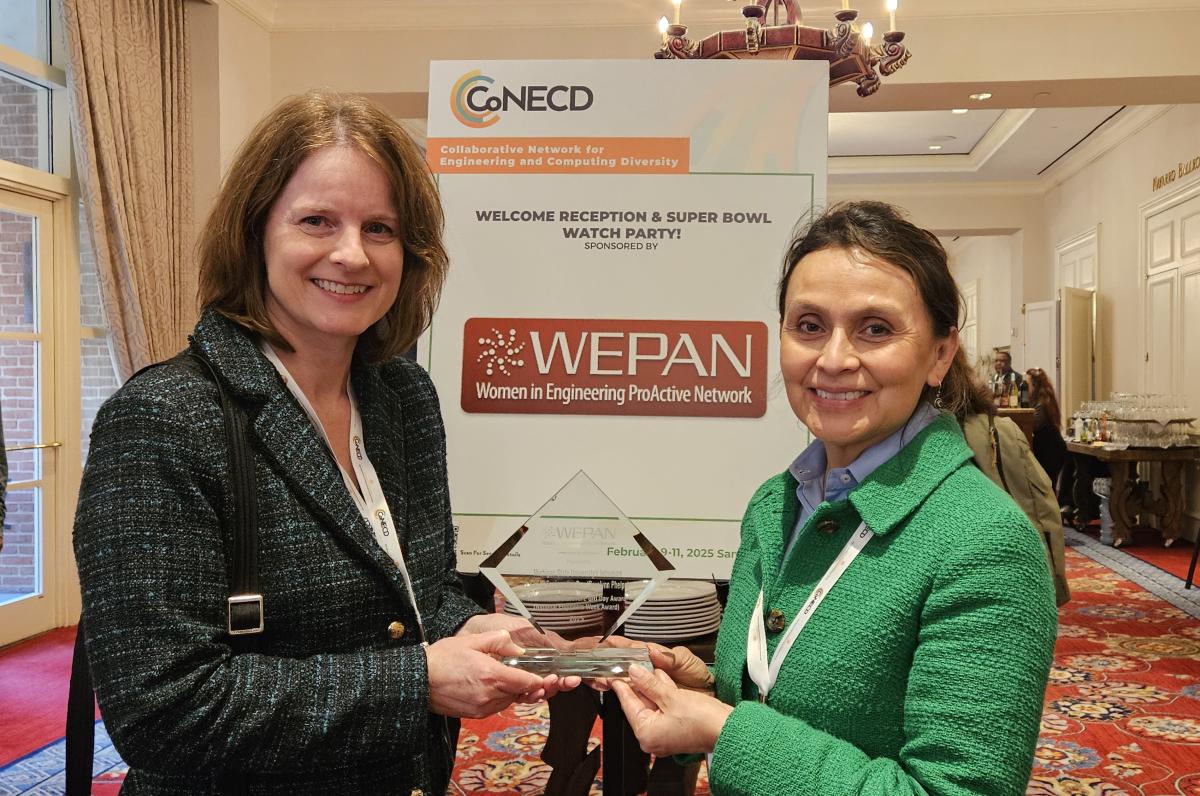 Vandersloot and Phelps posing with their WEPAN award