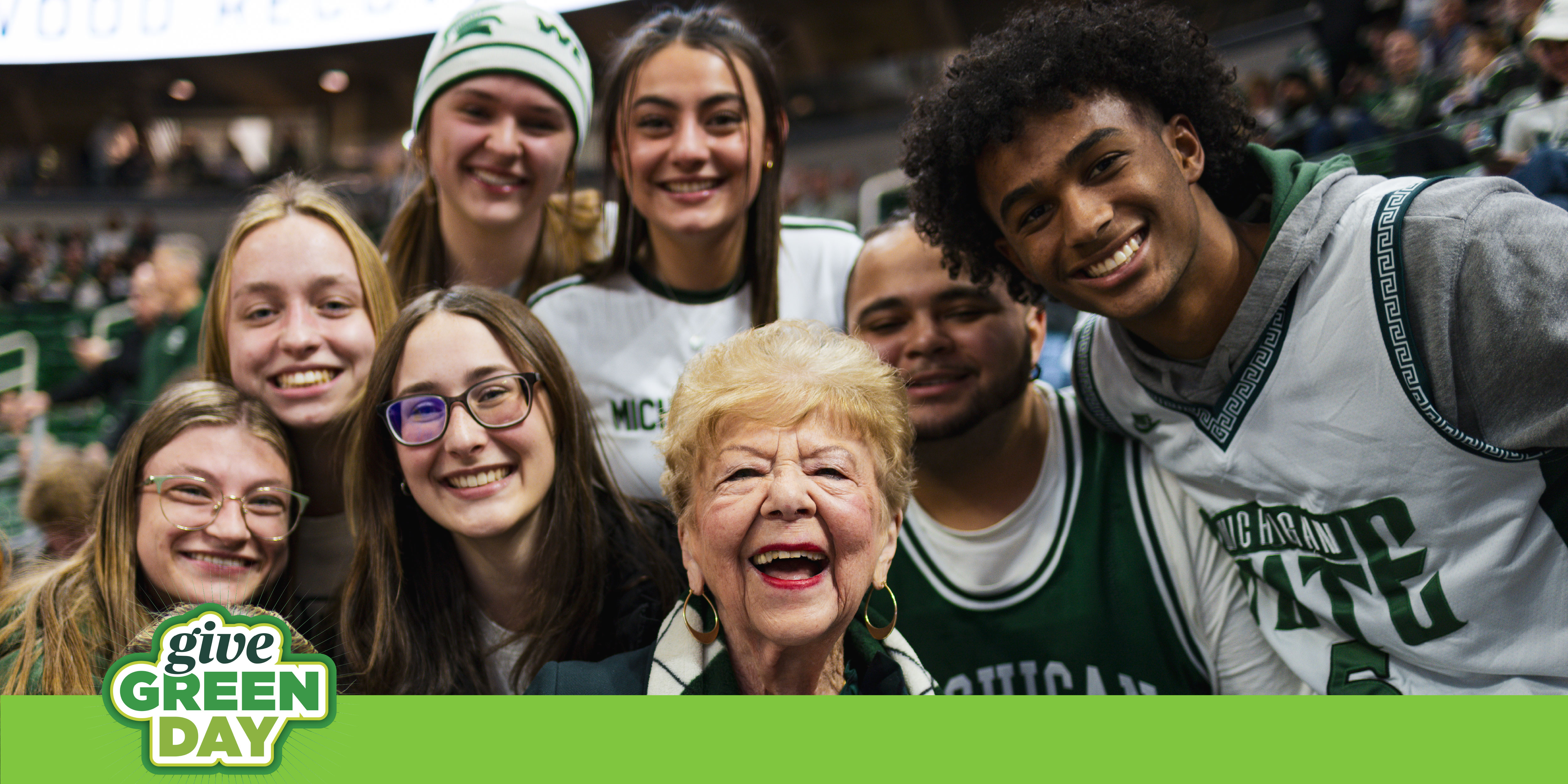 Students posing with a donor