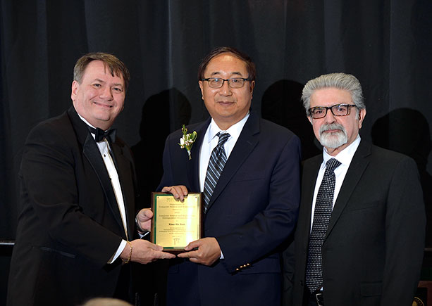 Xian-He Sun accepting the 2020 Alumni Award from College Dean Kempel and CSE Chairperson Abdol-Hossein Esfananian