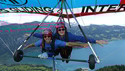 two people hang gliding in Switzerland while on a weekend break from the study abroad program in Aachen Germany