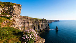 birds eye view of a mountain like landscape next to water view in Ireland