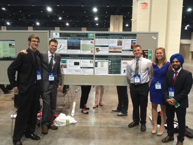 First Place Team at ECi Competition in Raleigh, NC (June 2015), MSU students standing in front of a poster of a project
