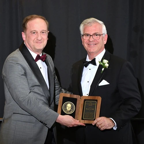 John Papapolymerou and David A. Pahl posing with award