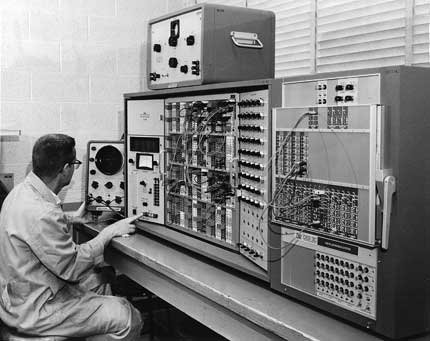 An individual in front of the PACE TR-48, an analog computer
