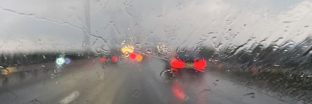View through a car windshield on a rainy day