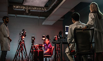 Doctor Tammy Bush with MSU students working on a hand sensor project