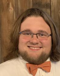 Professional headshot of Tyler Lovell