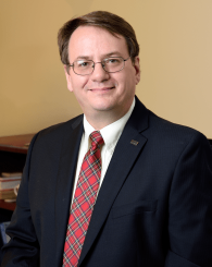 Professional headshot of Leo Kempel
