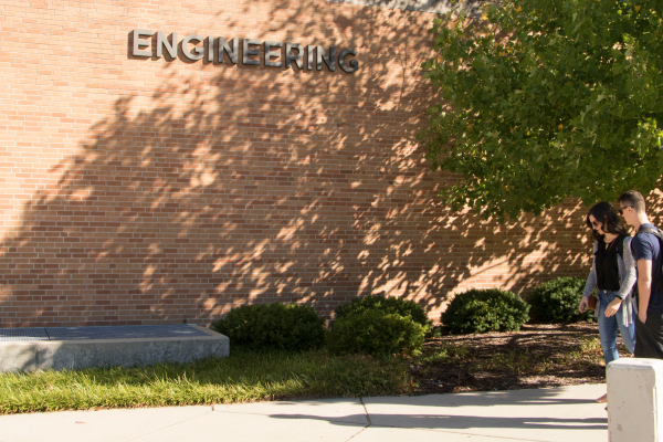 Two students walking outside the Engineering Building