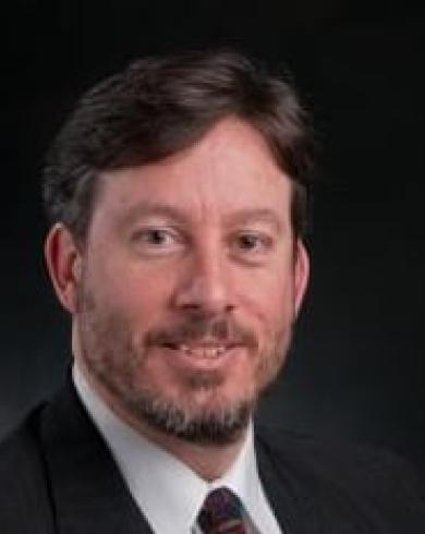 Professional headshot of John Verboncoeur
