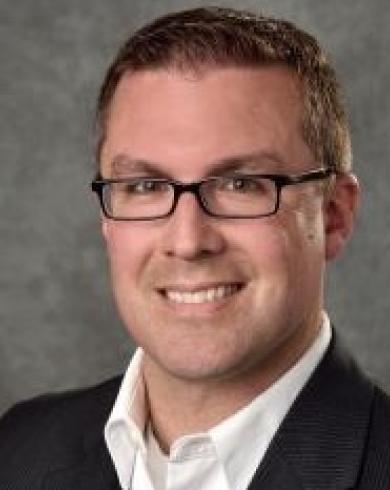 Professional headshot of Timothy Gates