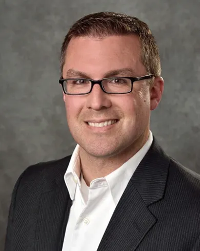 Professional headshot of Timothy Gates